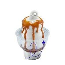 HEATH® Caramel Brownie on the Dairy Queen menu made with vanilla soft serve, rich caramel sauce, brownie pieces, and crunchy HEATH® toffee bits